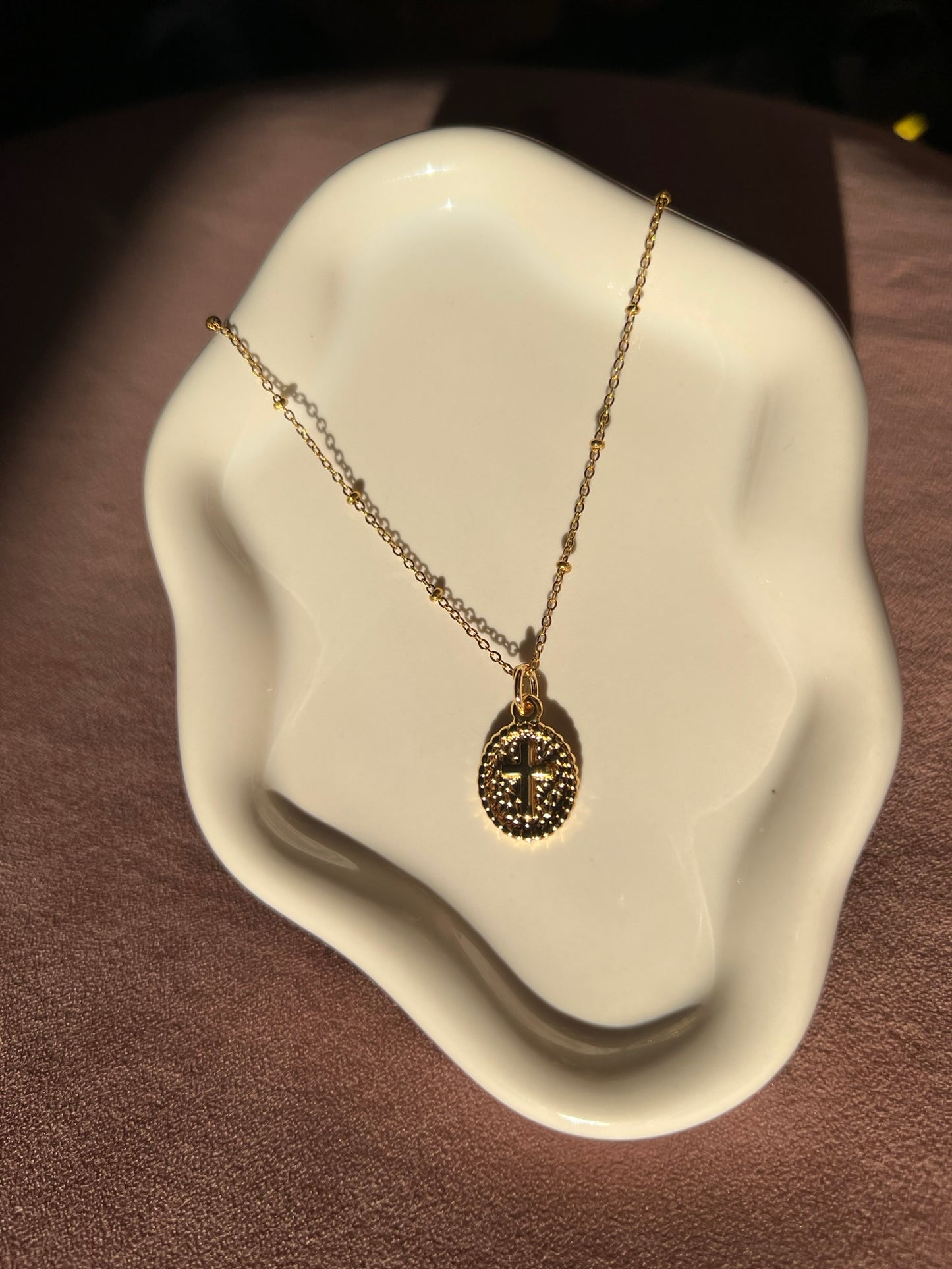 Gold Oval Cross