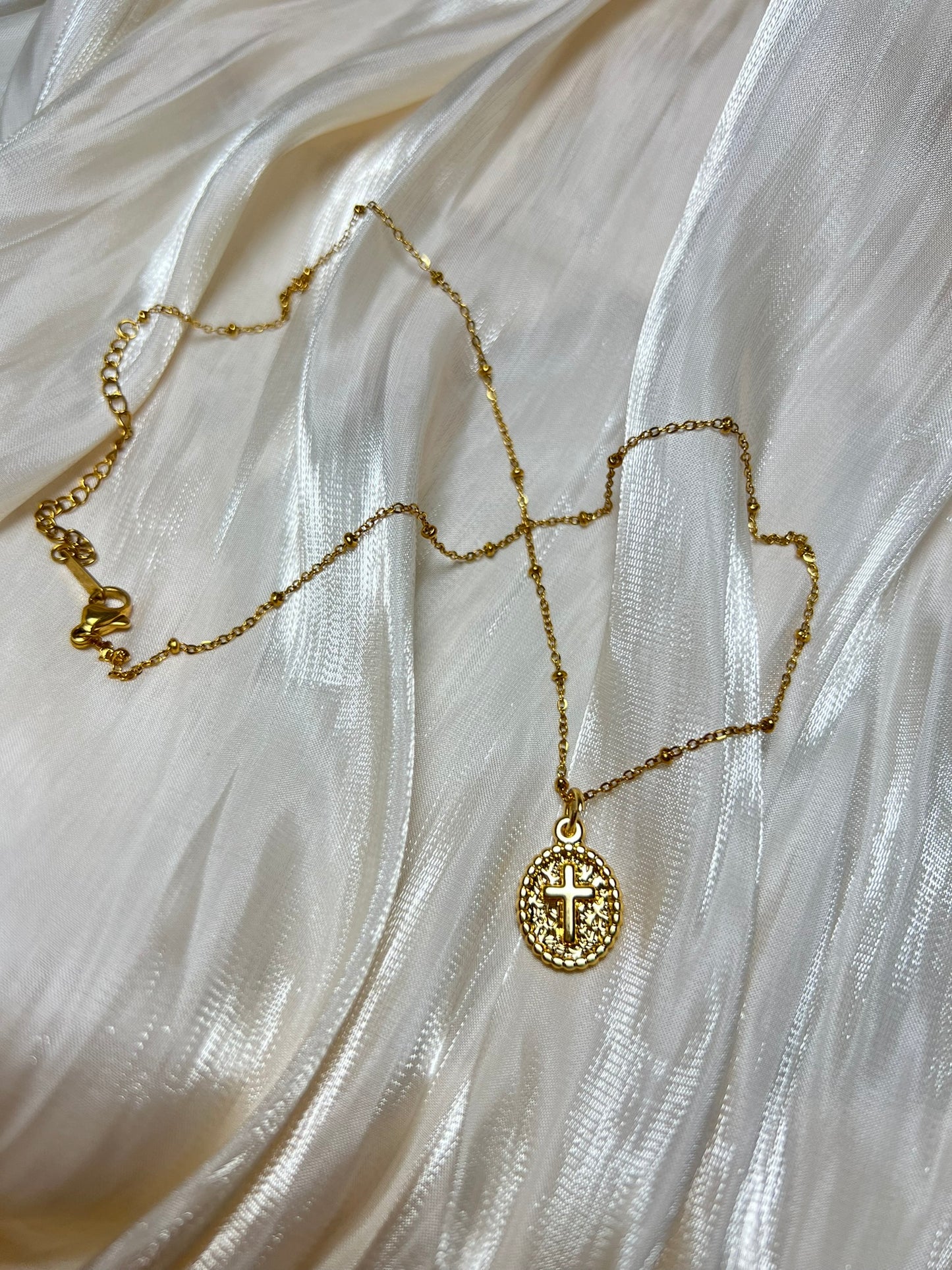 Gold Oval Cross