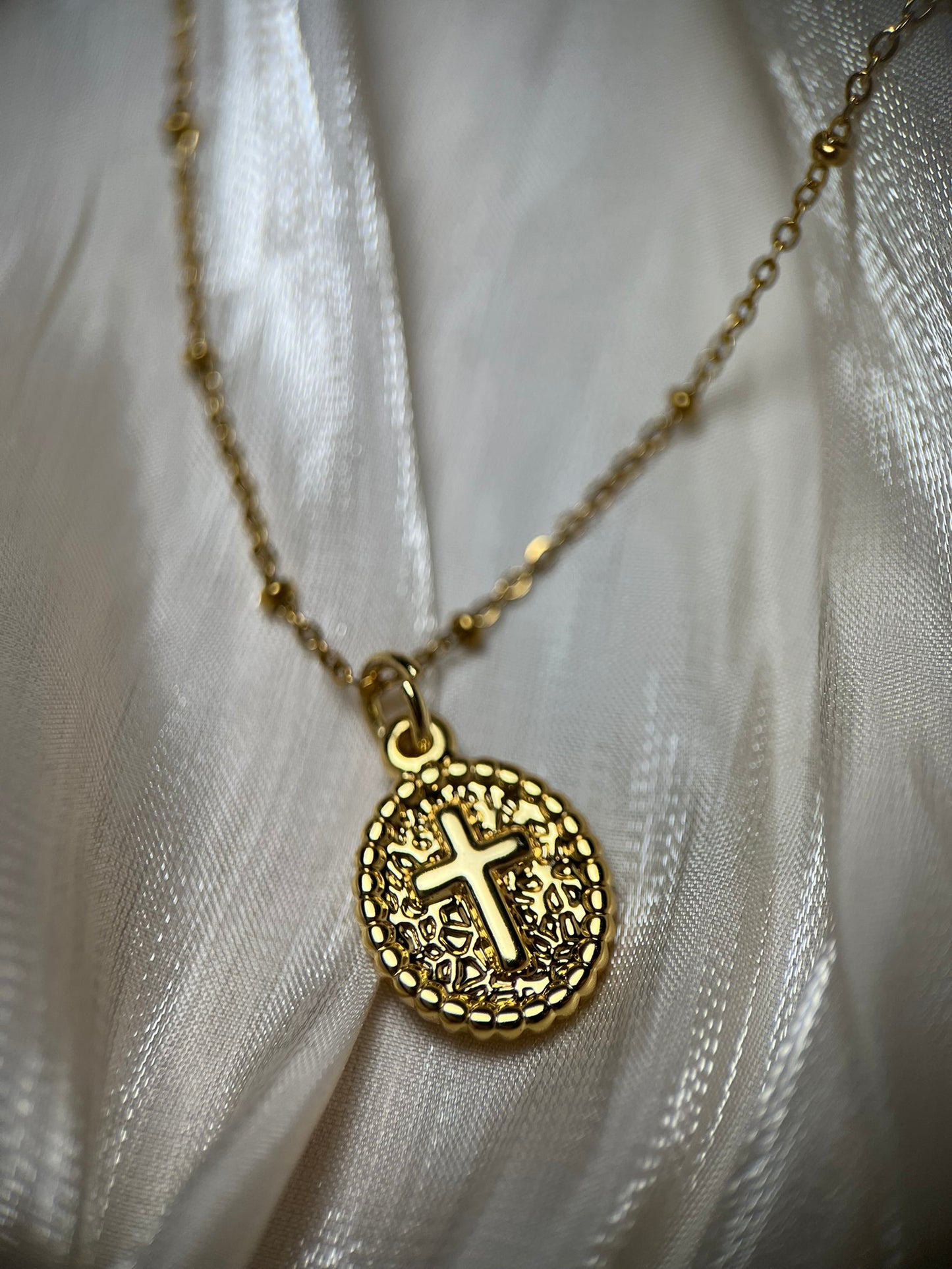 Gold Oval Cross